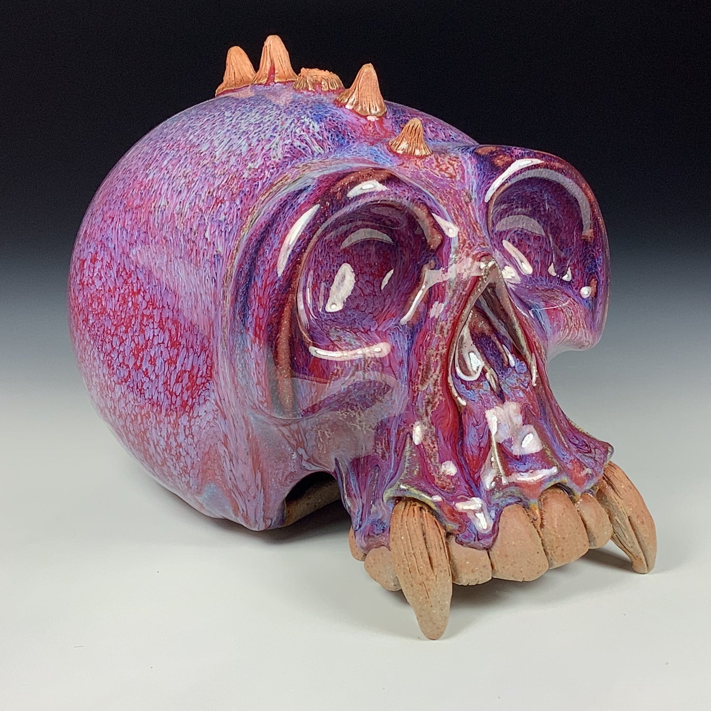 Handmade stoneware art abstract ceramic sculptures pottery decoration skull - Purple red wheel thrown enclosed form altered skull sculpture - item 3878