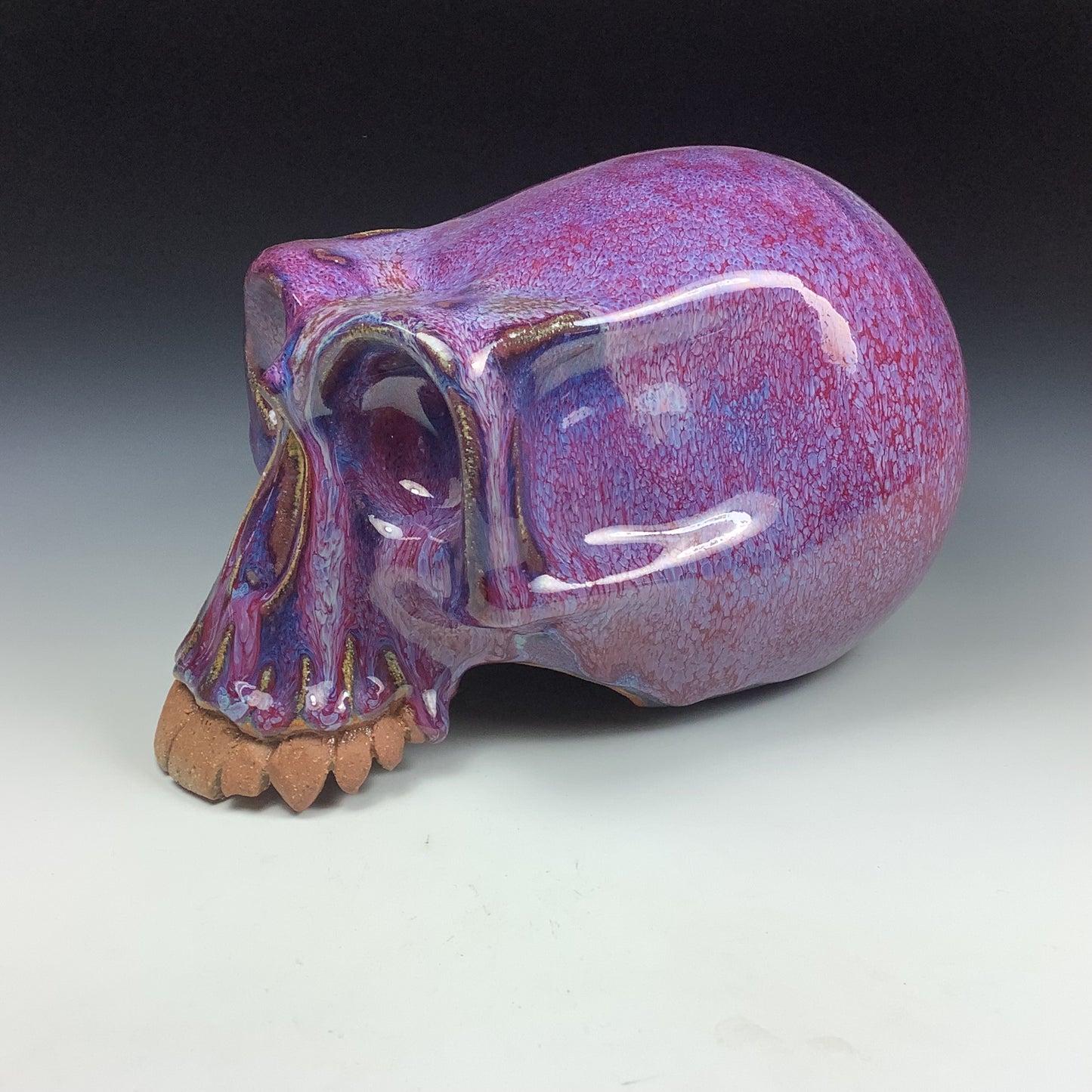 Handmade stoneware art abstract ceramic sculptures pottery decoration skull - Purple wheel thrown enclosed form altered skull sculpture - item 3587